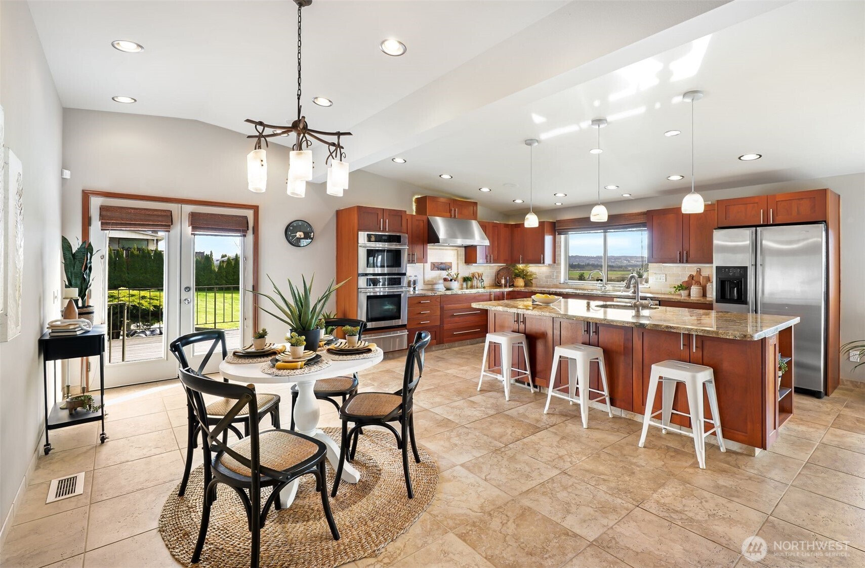2004 Valley View Drive Lake Stevens, WA 98258 - Photo 5 of 40 an open kitchen with granite countertop a table and chairs