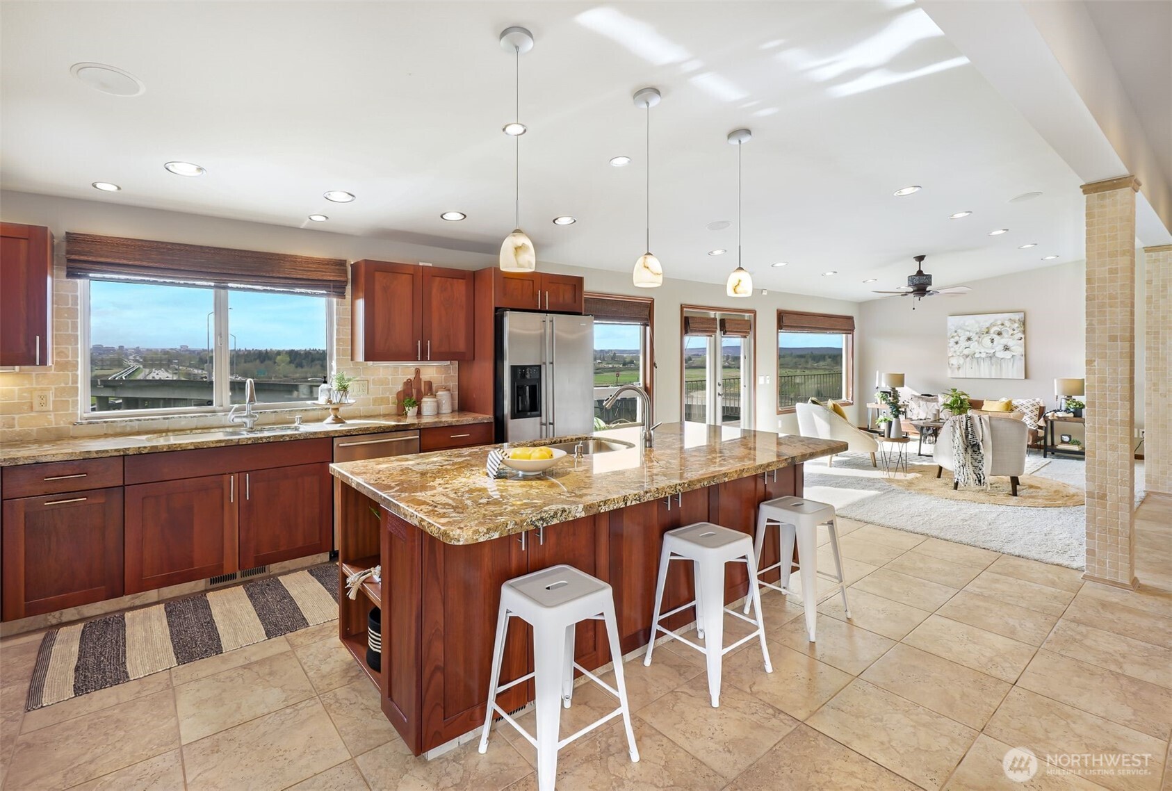 2004 Valley View Drive Lake Stevens, WA 98258 - Photo 8 of 40 a kitchen with stainless steel appliances granite countertop a stove a sink a oven a dining table and chairs