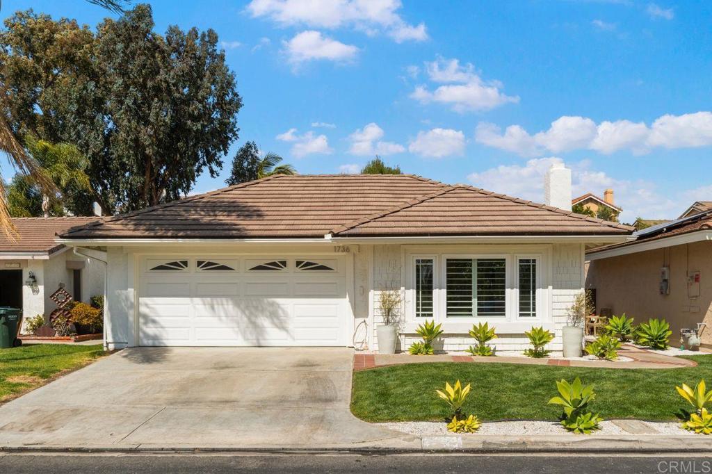 1736 Hill Top Lane Encinitas, CA 92024 - Photo 1 of 41 a front view of a house with a yard and garage