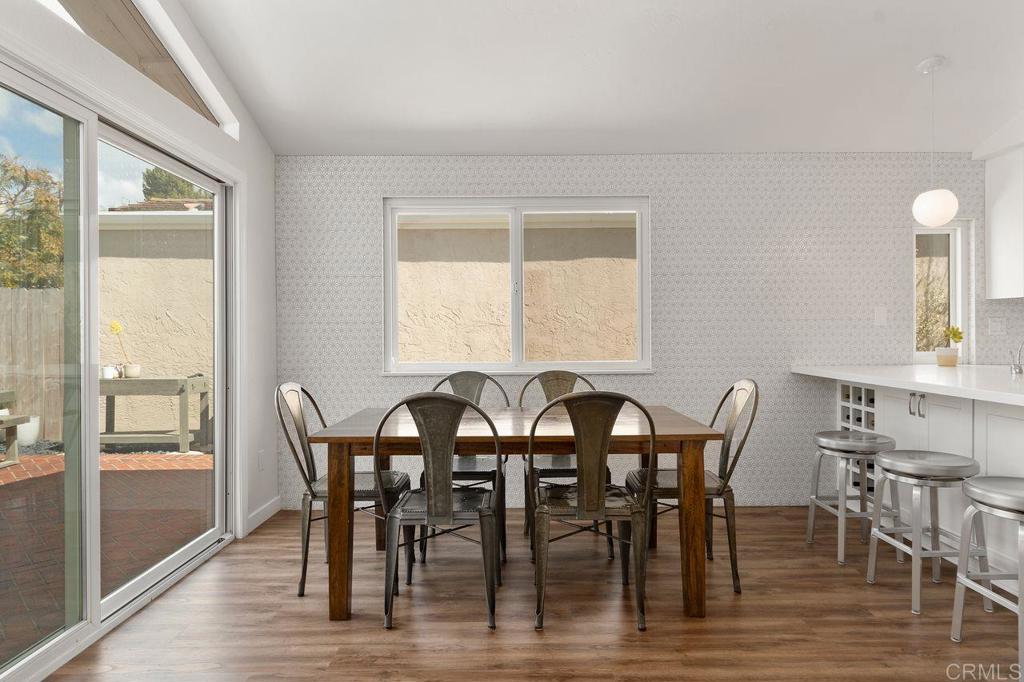 1736 Hill Top Lane Encinitas, CA 92024 - Photo 13 of 41 a view of a dining room with furniture and wooden floor