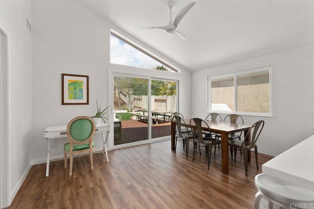 1736 Hill Top Lane Encinitas, CA 92024 - Photo 14 of 41 a dining room with furniture a rug and wooden floor