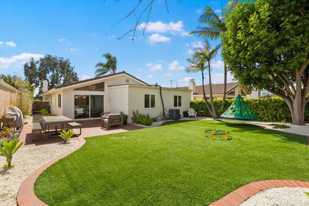 1736 Hill Top Lane Encinitas, CA 92024 - Photo 15 of 41 a view of a house with backyard sitting area and garden