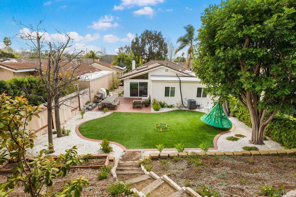 1736 Hill Top Lane Encinitas, CA 92024 - Photo 22 of 41 a front view of a house with garden