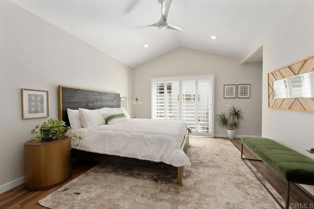 1736 Hill Top Lane Encinitas, CA 92024 - Photo 24 of 41 a spacious bedroom with a bed a couch and potted plant