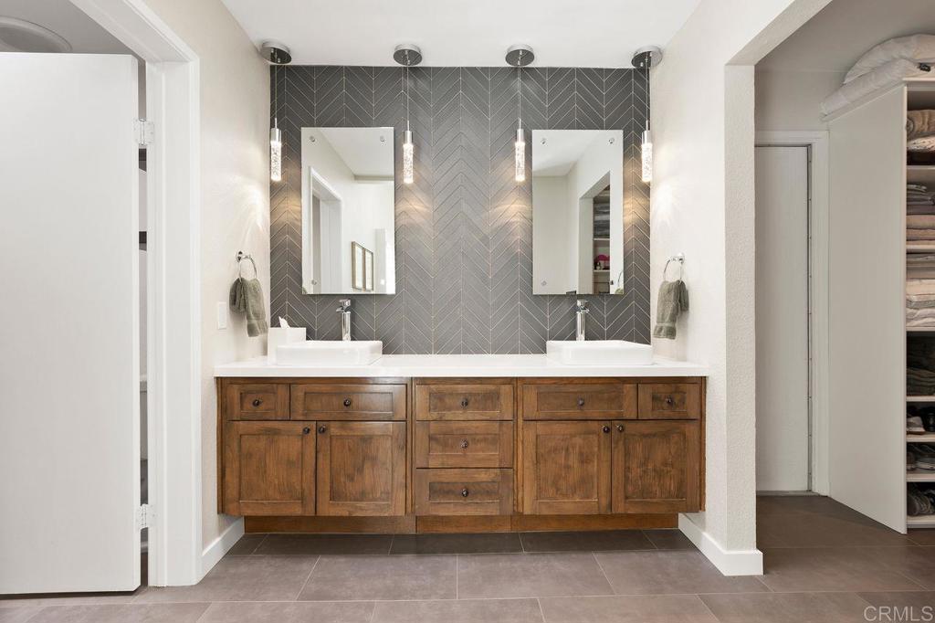 1736 Hill Top Lane Encinitas, CA 92024 - Photo 27 of 41 a bathroom with a double vanity sink mirror and
