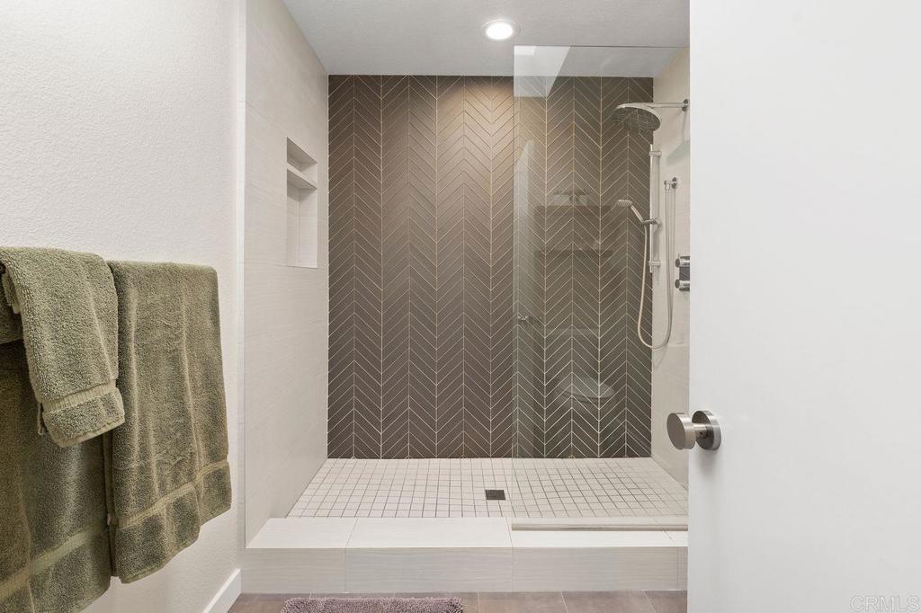 1736 Hill Top Lane Encinitas, CA 92024 - Photo 28 of 41 a bathroom with a bathtub and a shower