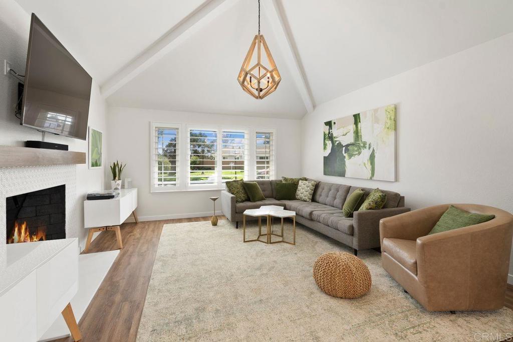 1736 Hill Top Lane Encinitas, CA 92024 - Photo 4 of 41 a living room with furniture a fireplace and a flat screen tv