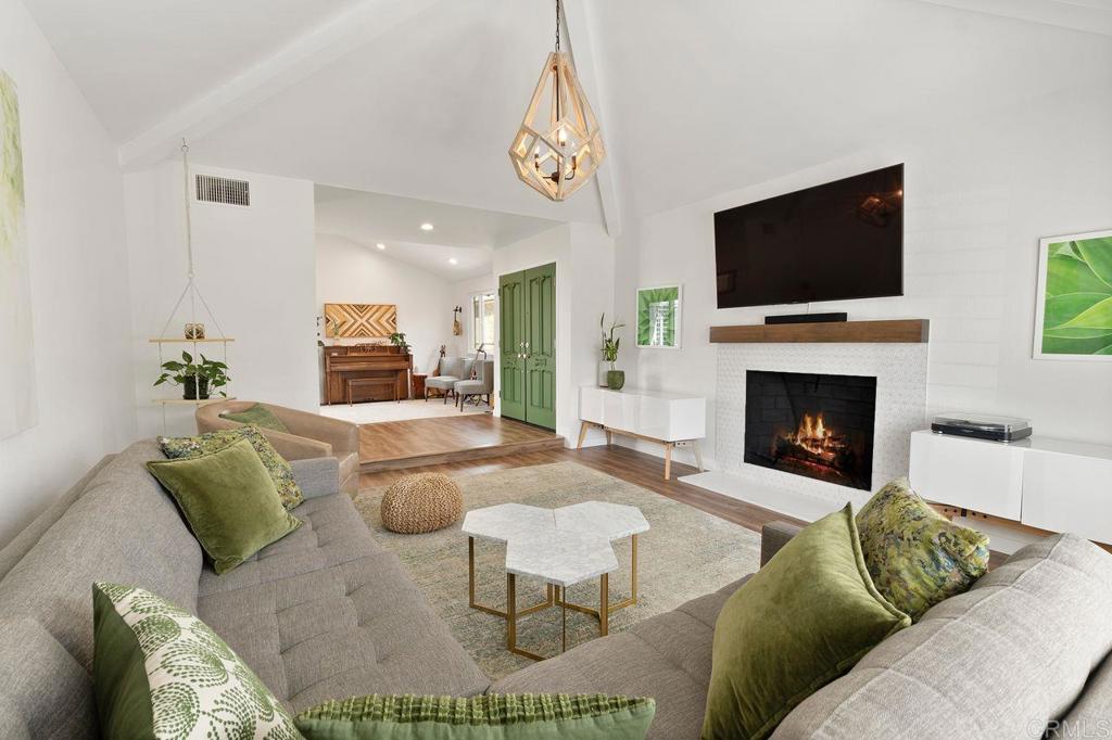 1736 Hill Top Lane Encinitas, CA 92024 - Photo 5 of 41 a living room with furniture and a flat screen tv
