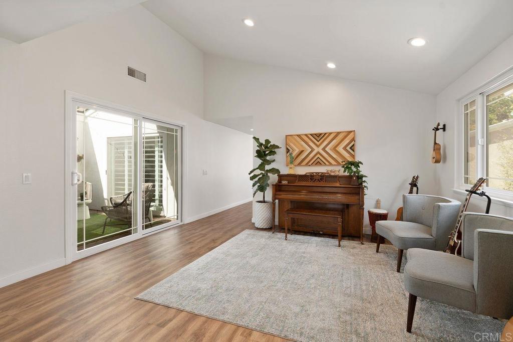 1736 Hill Top Lane Encinitas, CA 92024 - Photo 6 of 41 a living room with furniture and a flat screen tv