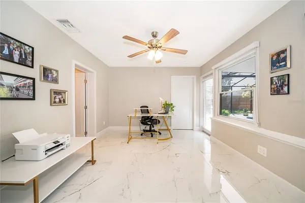 a living room with furniture and white walls