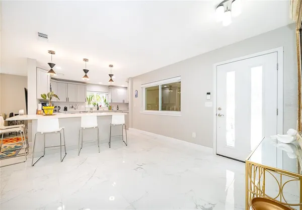 a view of kitchen with furniture and window