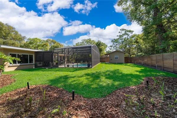 a view of a house with a back yard
