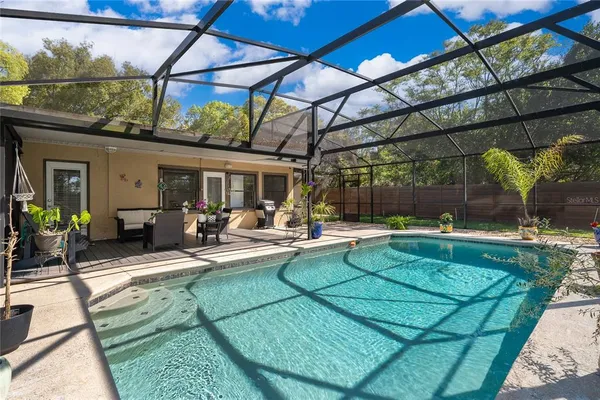 a view of a swimming pool with a patio