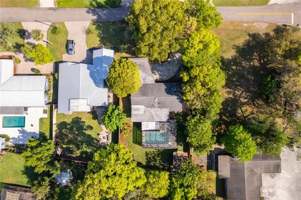 aerial view of a house with a yard and garden