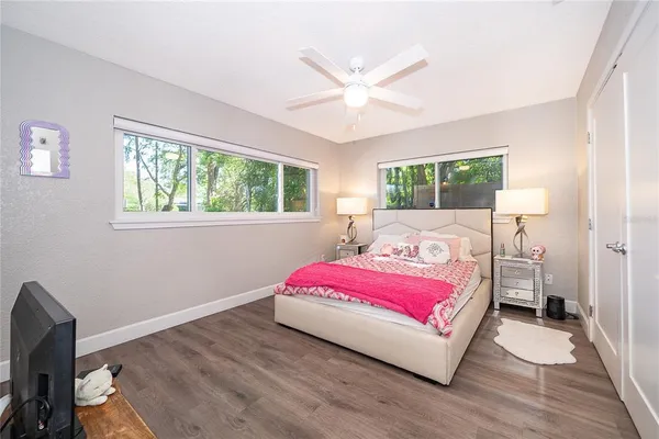a bedroom with a bed and window