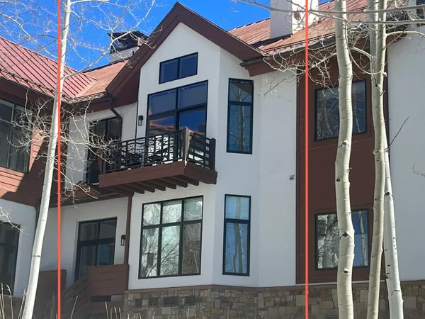 front view of a house with a large window