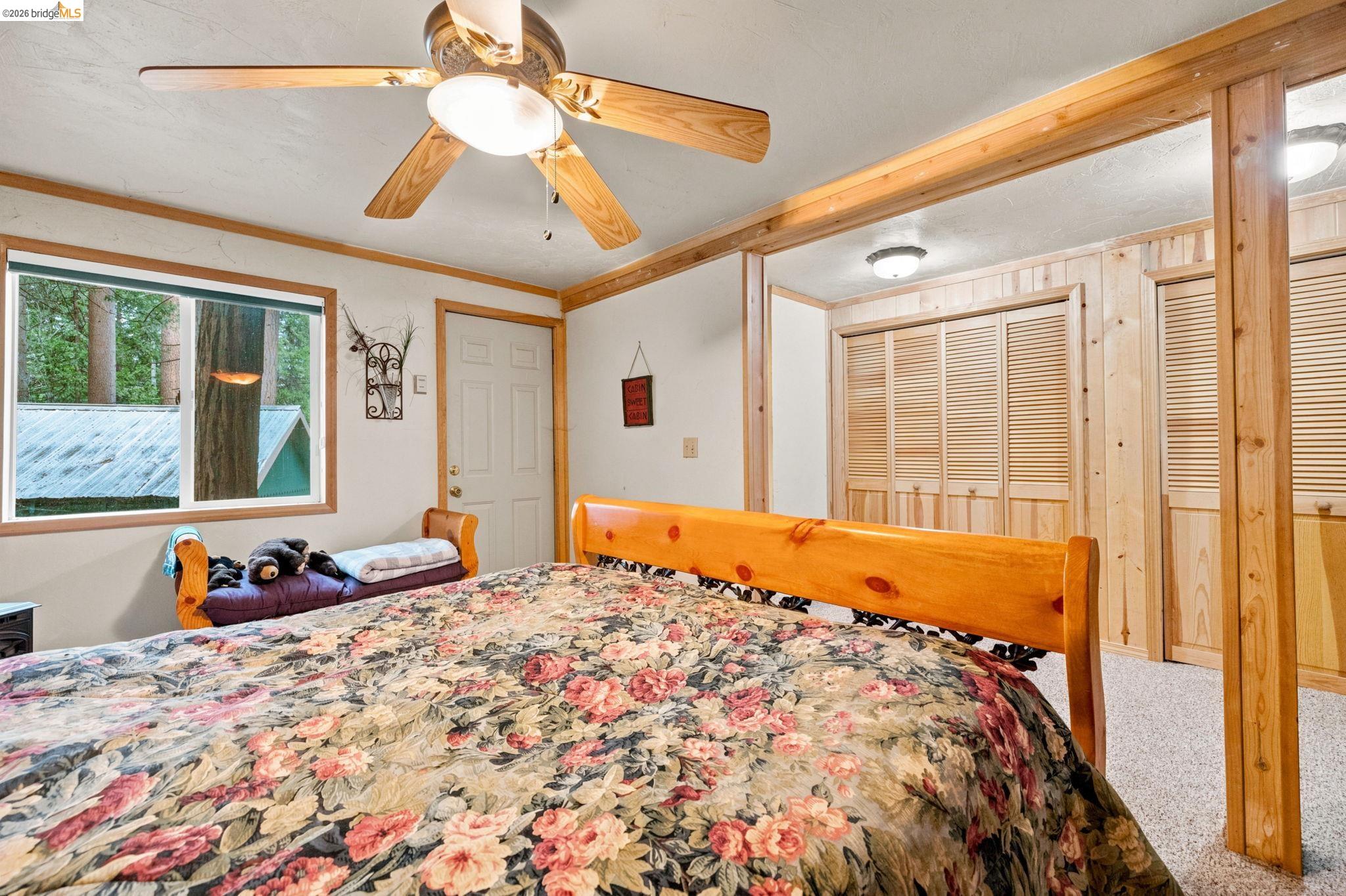 25822 Long Barn Sugar Pine Road Long Barn, CA 95335 - Photo 25 of 28 a bed sitting in a bedroom next to a window