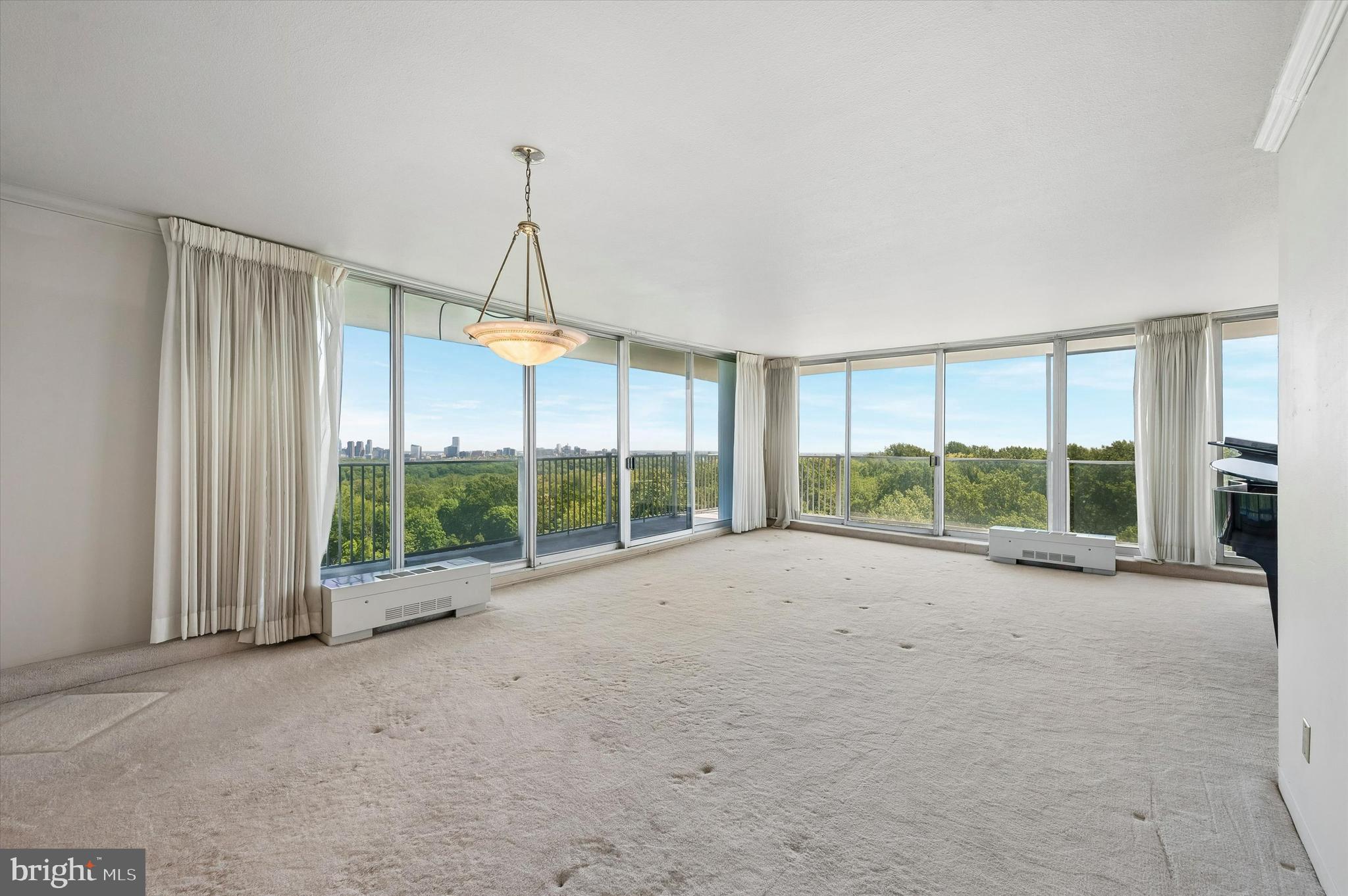 3900 West Ford Road, Unit 16E Philadelphia, PA 19131 - Photo 12 of 14 Livingroom with view from wrap around balcony