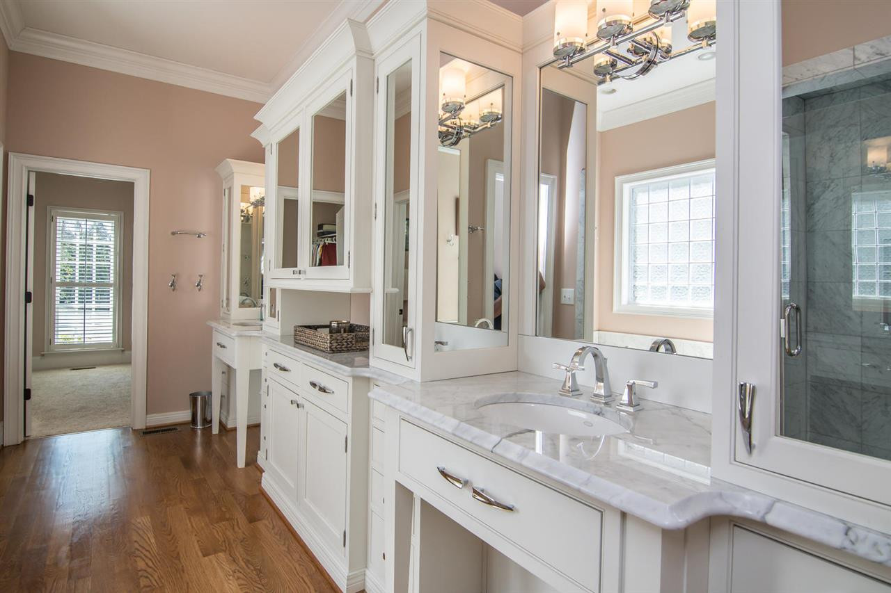 3310 Westover Road Durham, NC 27707 - Photo 14 of 30 a bathroom with double vanity sinks a vanity two mirror and a window