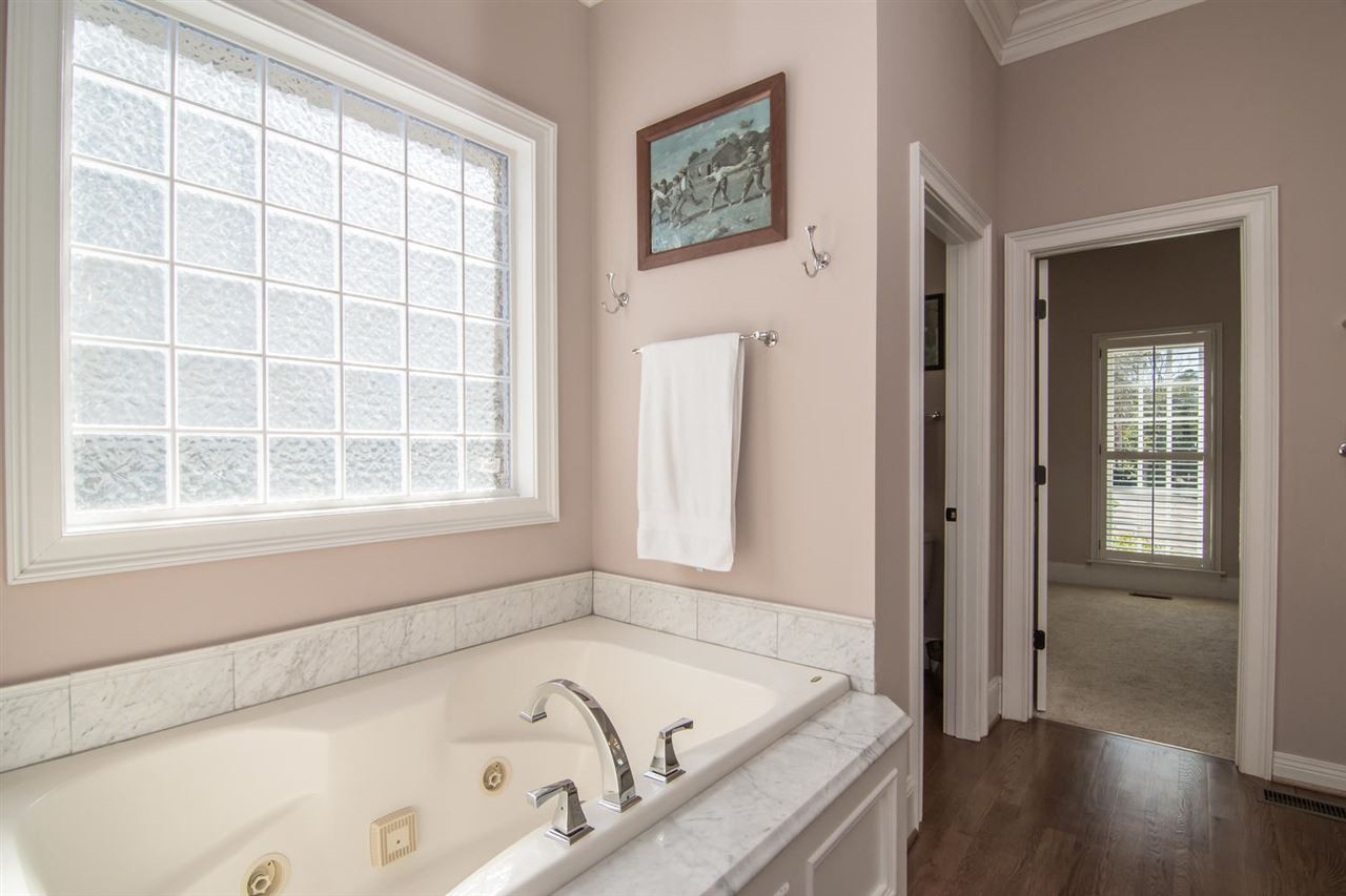 3310 Westover Road Durham, NC 27707 - Photo 15 of 30 a bathroom with a tub and a window