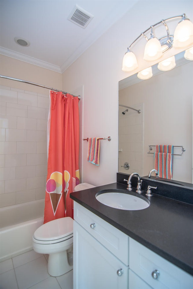 3310 Westover Road Durham, NC 27707 - Photo 18 of 30 a bathroom with a sink a toilet and a mirror