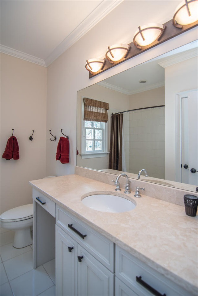 3310 Westover Road Durham, NC 27707 - Photo 24 of 30 a bathroom with a sink vanity and a toilet