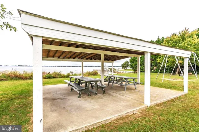 a view of a chairs and table in the patio