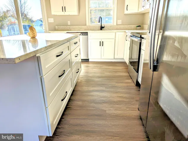 a bathroom with a sink a mirror and a bathtub