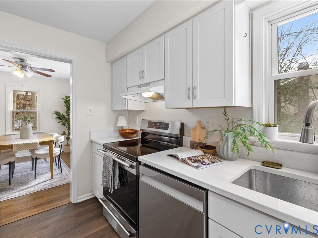 13217 Court Ridge Road Midlothian, VA 23112 - Photo 23 of 37 a kitchen with a stove cabinets and wooden floor