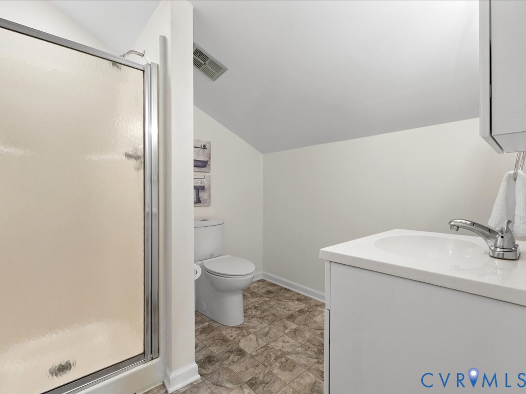 13217 Court Ridge Road Midlothian, VA 23112 - Photo 33 of 37 a bathroom with a sink a toilet and shower