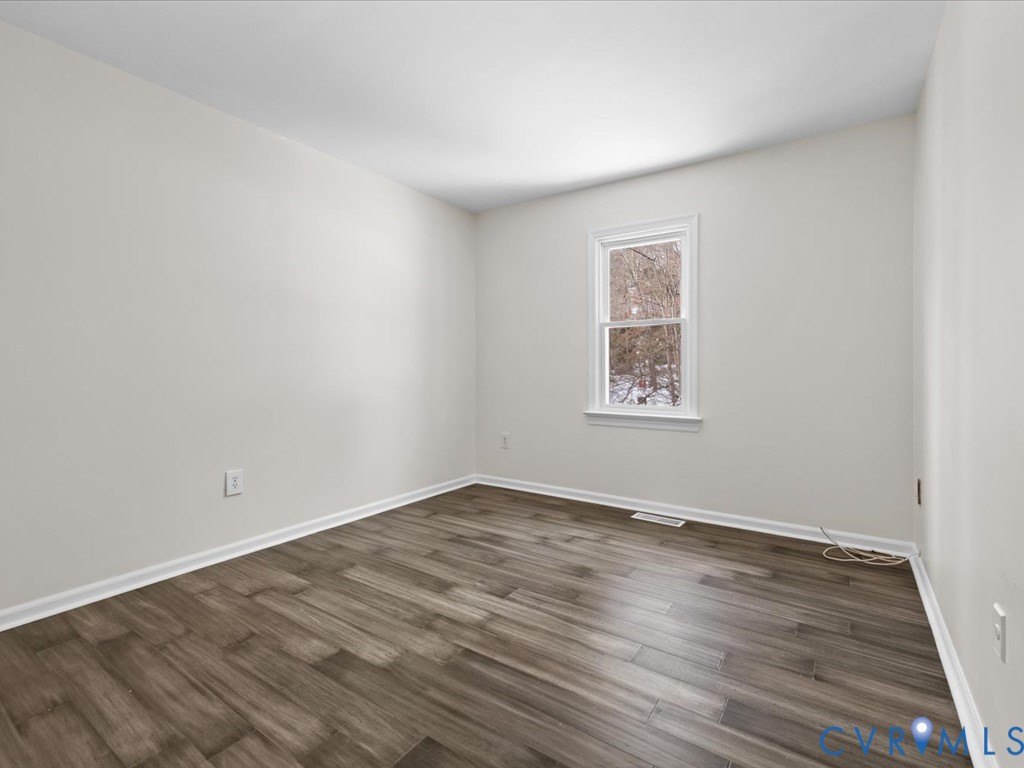13217 Court Ridge Road Midlothian, VA 23112 - Photo 35 of 37 an empty room with wooden floor and windows
