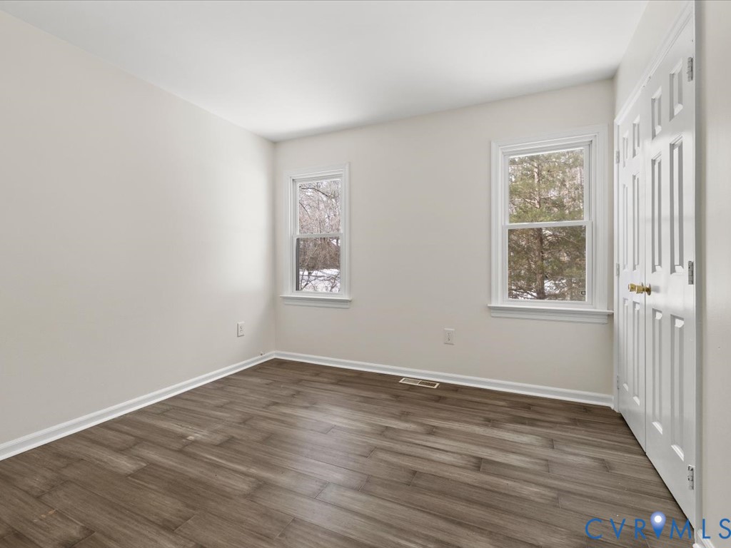 13217 Court Ridge Road Midlothian, VA 23112 - Photo 36 of 37 a view of an empty room with wooden floor and a window
