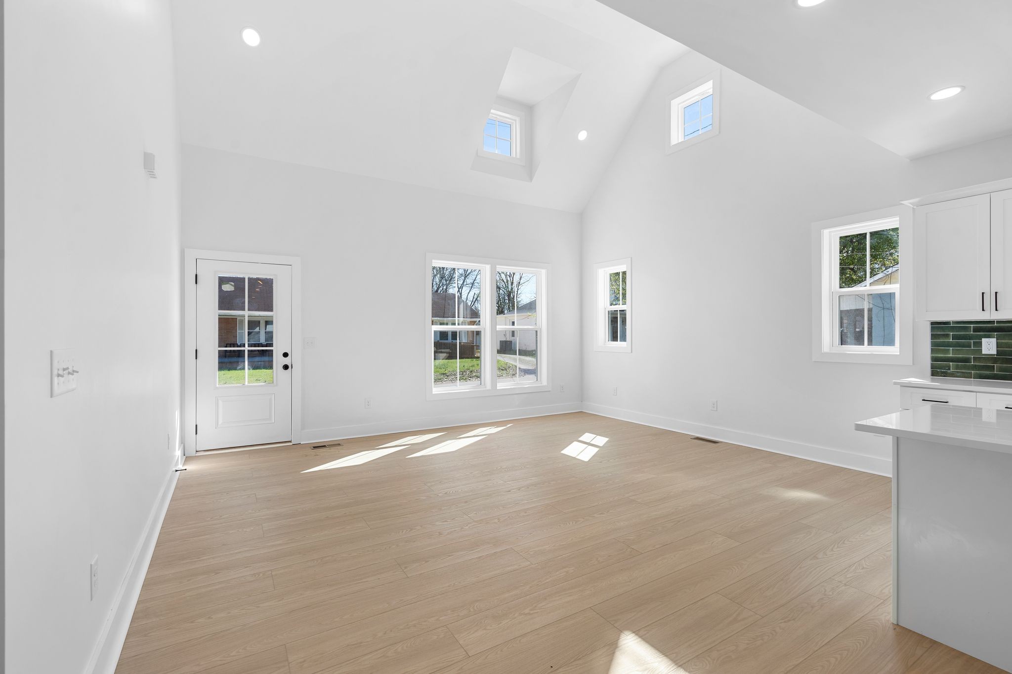 930 Glass Street Franklin, TN 37064 - Photo 29 of 34 a view of an empty room with a window and a kitchen