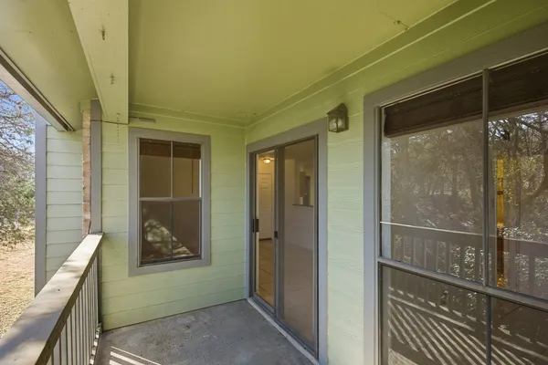 a view of a door and a window