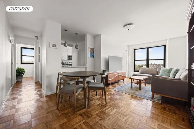 a dining room with furniture and wooden floor