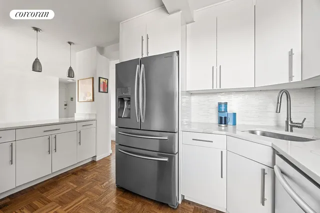 a refrigerator freezer sitting inside of a kitchen