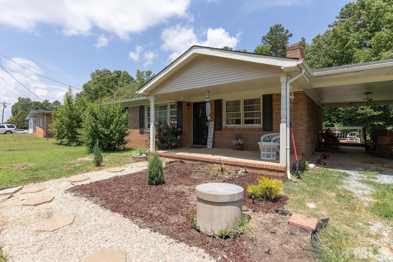 680 Haywood Bailey Road Roxboro, NC 27574 - Photo 1 of 29 a front view of house with yard having outdoor seating