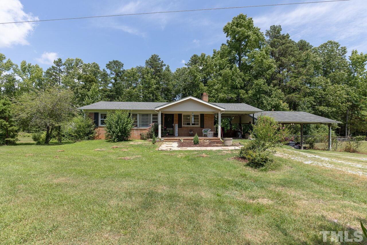 680 Haywood Bailey Road Roxboro, NC 27574 - Photo 2 of 29 a front view of house with yard and trees