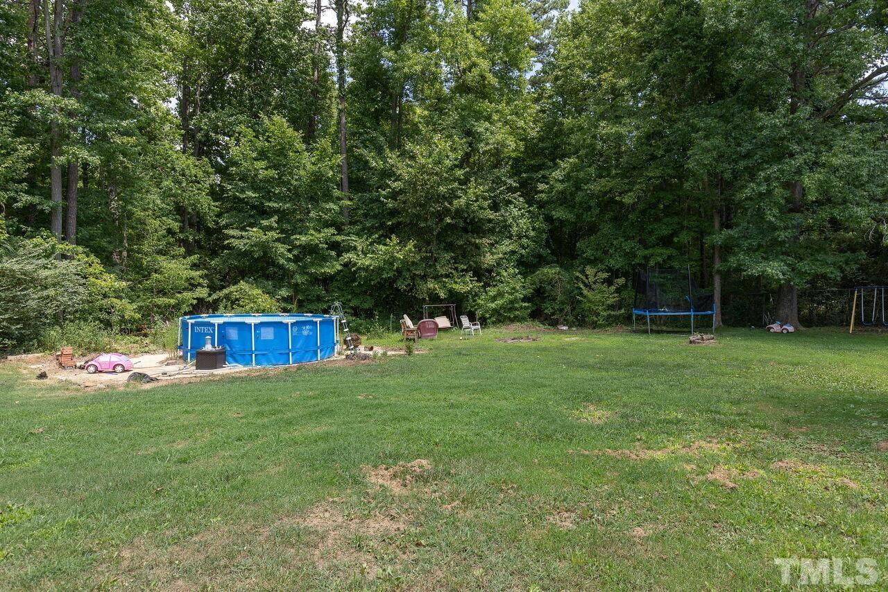 680 Haywood Bailey Road Roxboro, NC 27574 - Photo 29 of 29 a view of an house with a yard