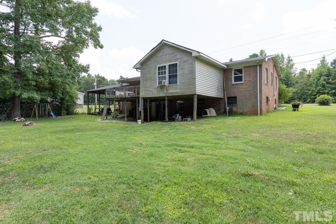 680 Haywood Bailey Road Roxboro, NC 27574 - Photo 4 of 29 a view of a house with a yard