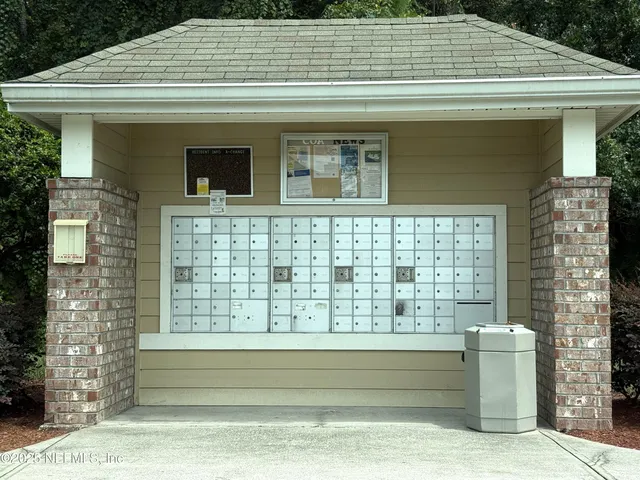 a view of front door and potted plants