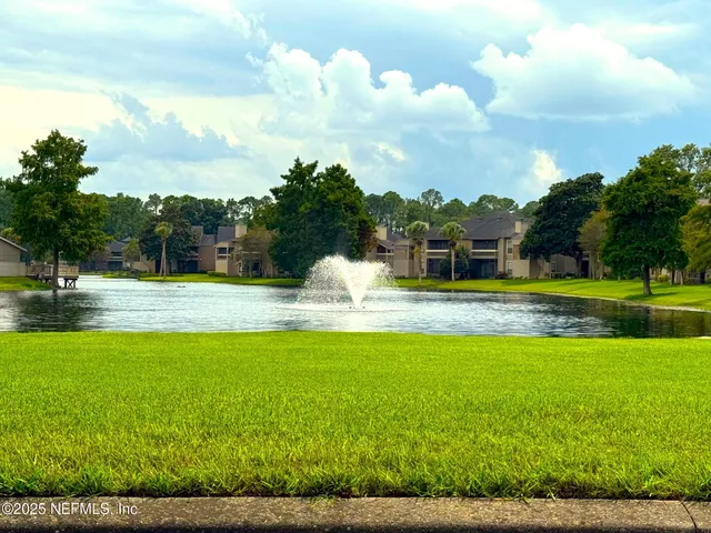 a swimming pool with an outdoor seating