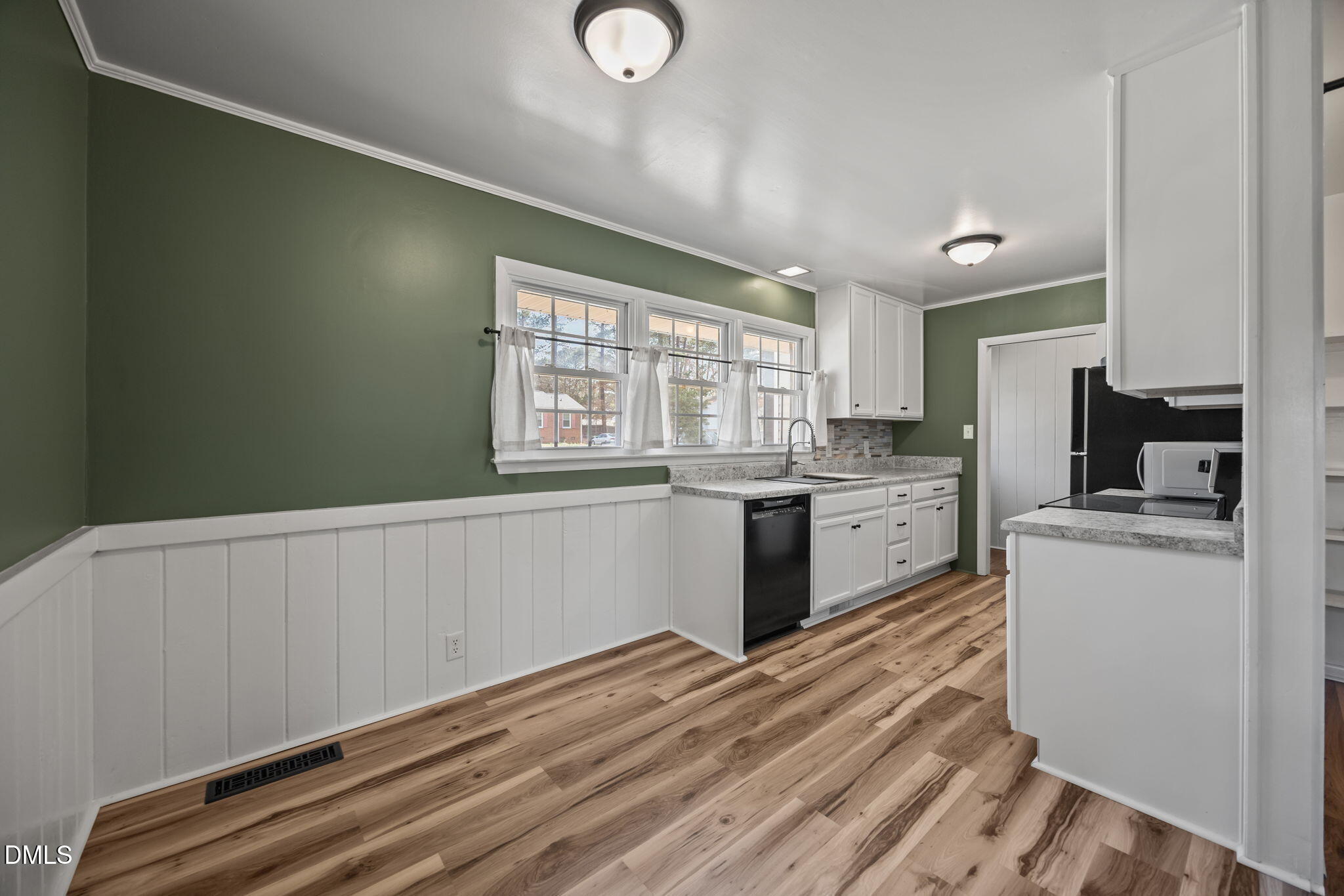 3521 Huntleigh Drive Raleigh, NC 27604 - Photo 8 of 56 a kitchen with a refrigerator and a stove top oven