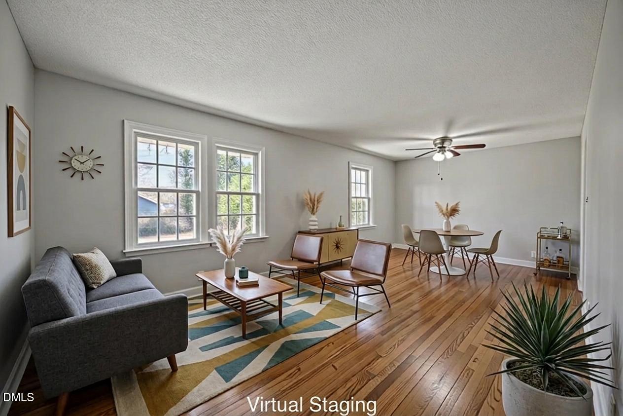3521 Huntleigh Drive Raleigh, NC 27604 - Photo 12 of 56 a living room with furniture and wooden floor