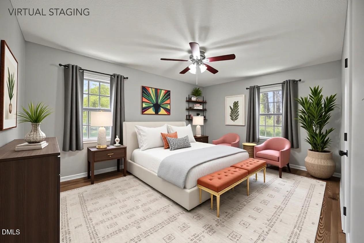 3521 Huntleigh Drive Raleigh, NC 27604 - Photo 16 of 56 a bedroom with a large bed and windows