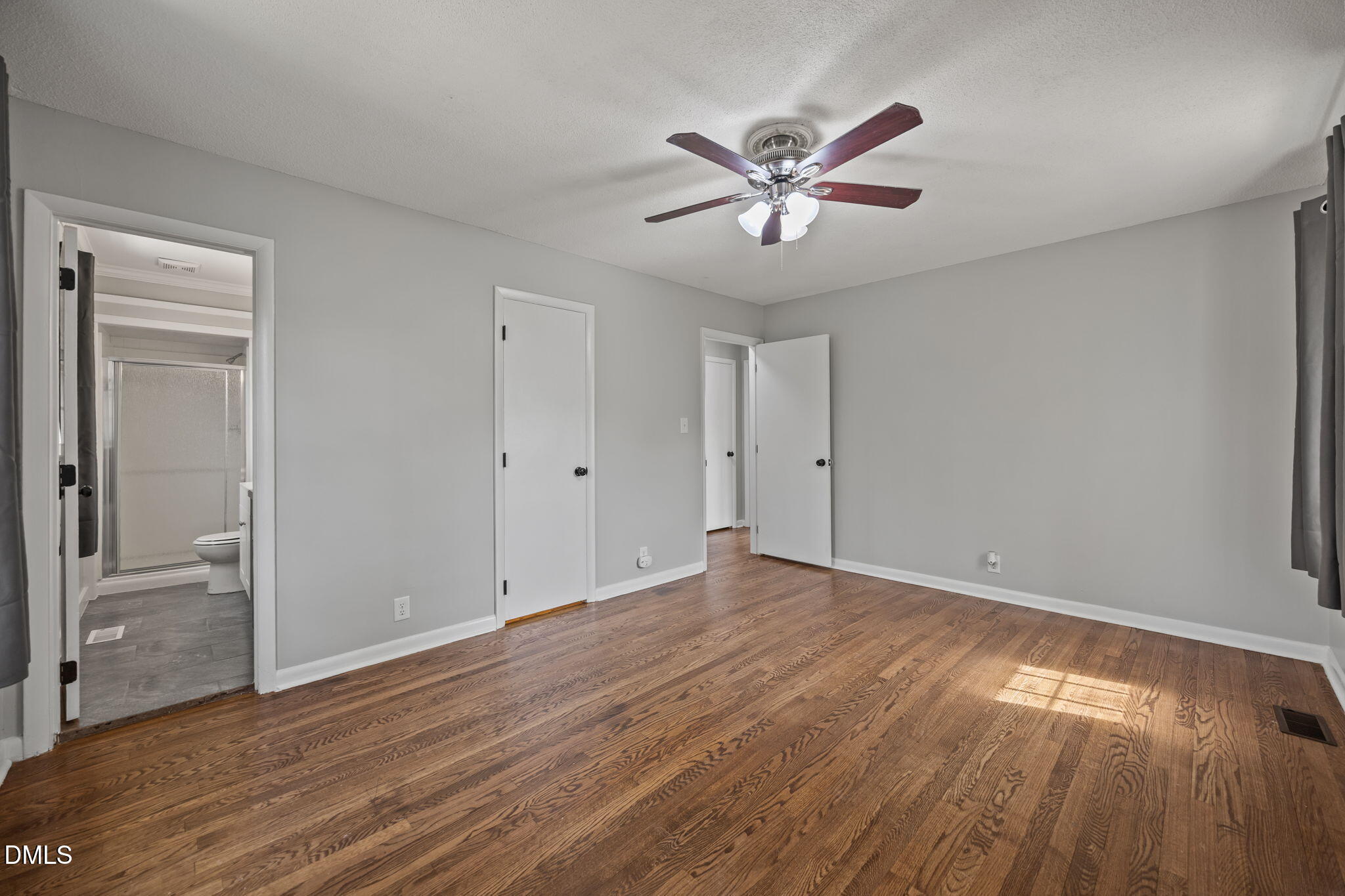 3521 Huntleigh Drive Raleigh, NC 27604 - Photo 18 of 56 a view of empty room with wooden floor and fan