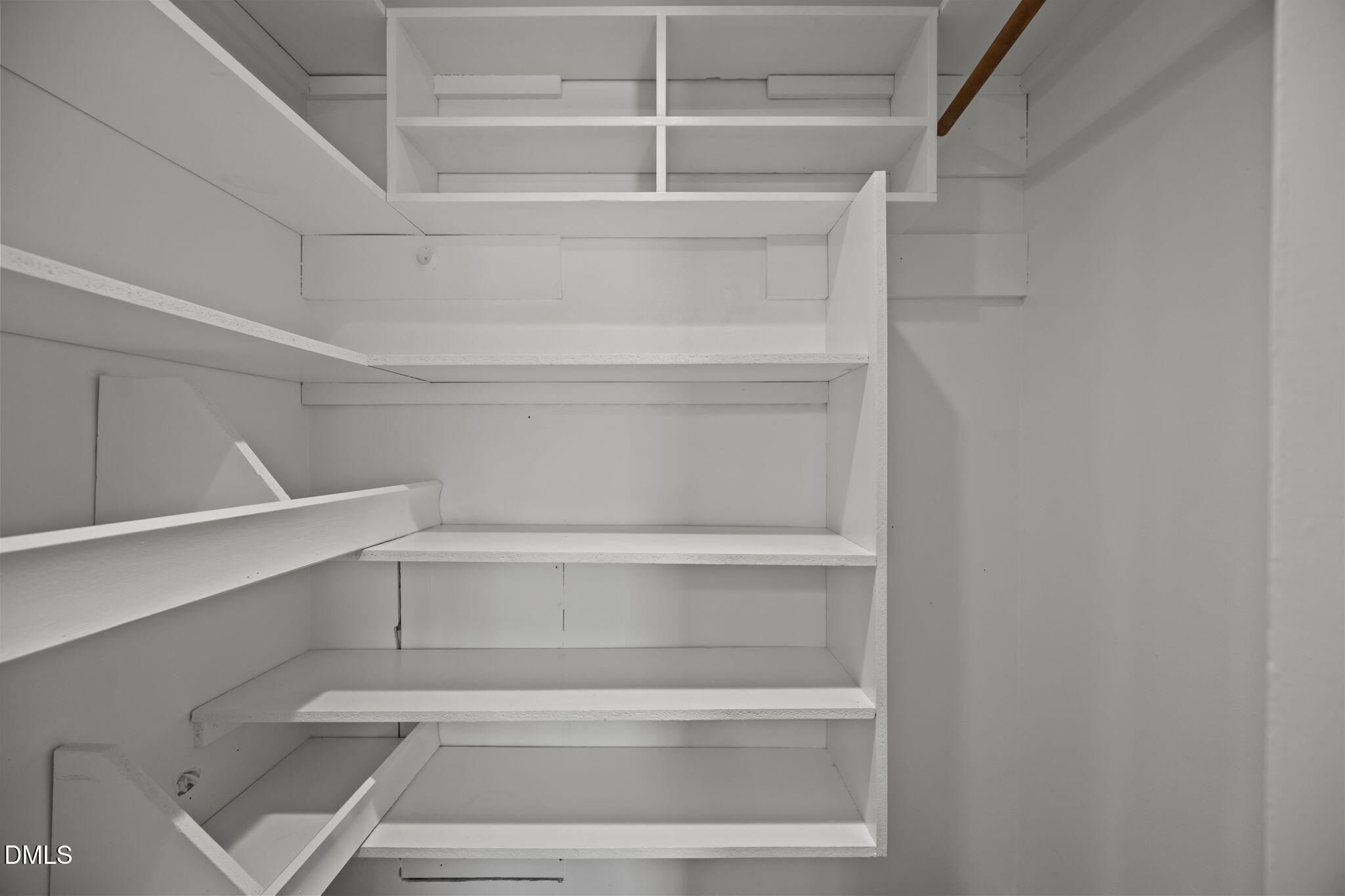 3521 Huntleigh Drive Raleigh, NC 27604 - Photo 20 of 56 a view of walk in closet with empty racks