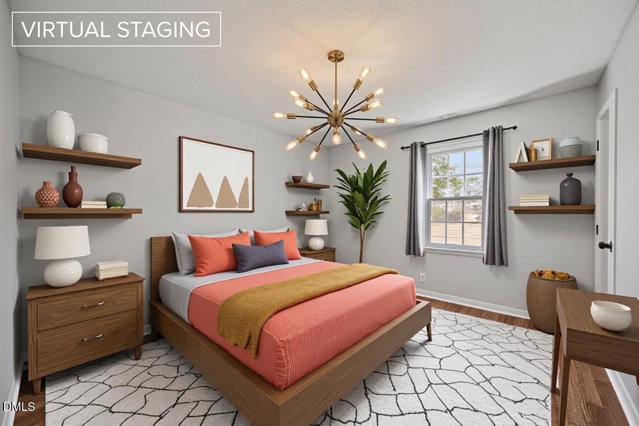 3521 Huntleigh Drive Raleigh, NC 27604 - Photo 21 of 56 a bedroom with a bed and window