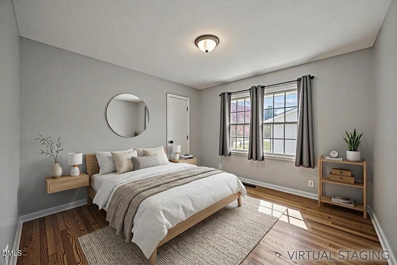 3521 Huntleigh Drive Raleigh, NC 27604 - Photo 23 of 56 a bedroom with a bed flowerpot and window