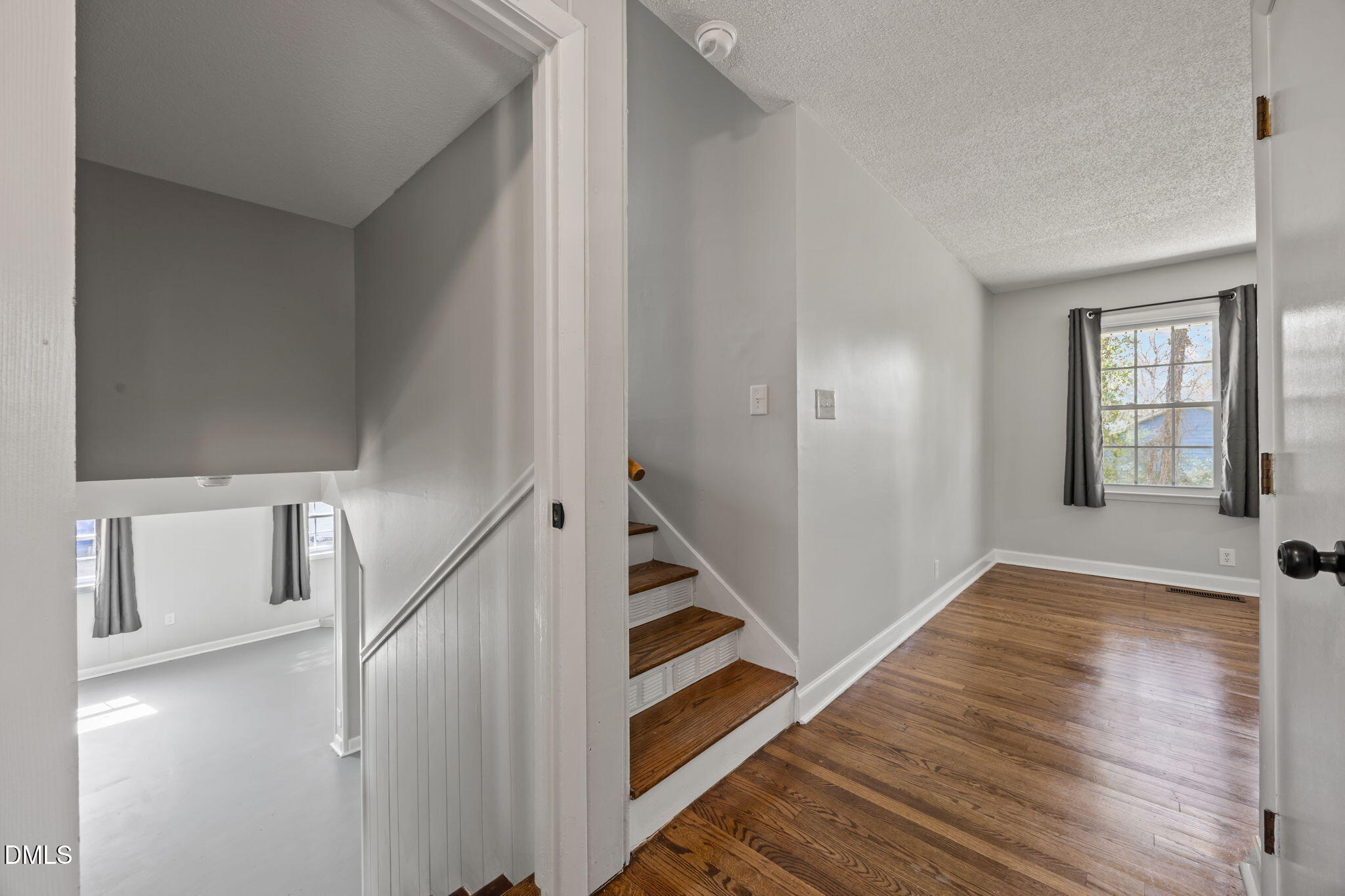 3521 Huntleigh Drive Raleigh, NC 27604 - Photo 26 of 56 a view of an entryway with wooden floor and stairs